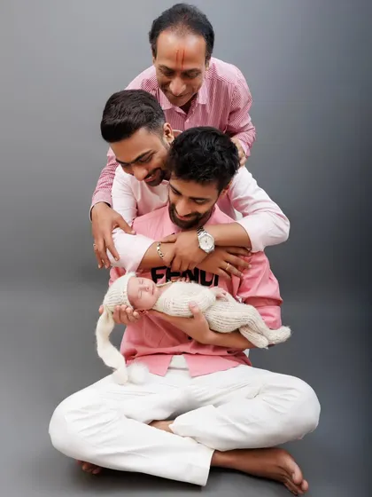 The same beautiful three-generation portrait, presented in soft color, highlighting the family's bond.