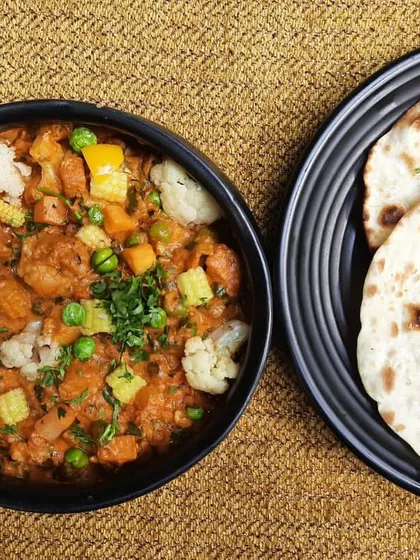 A classic pairing you can never go wrong with. Our Subz Dum Matka, a medley of fresh vegetables in a thick gravy, is served with soft, fluffy Kulchas, making it a wholesome and satisfying meal.