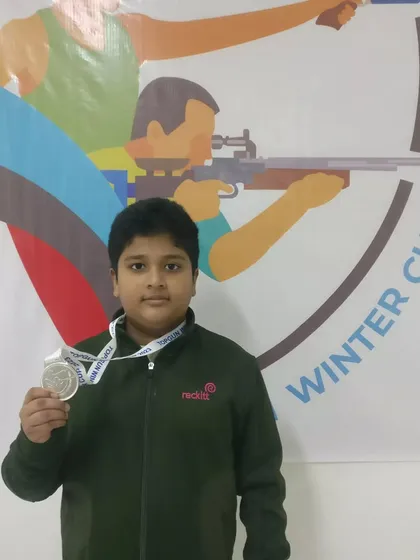 A young shooter with his silver medal from the TOPGUN WINTER CUP 2023. We focus on building a strong foundation of skill and sportsmanship from the very beginning.