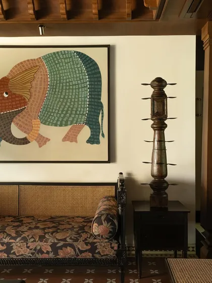 A close-up of a traditional wooden sculpture in the living room.