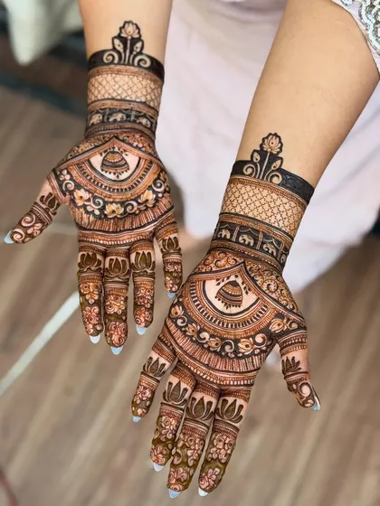 Another angle of the jhumki design, showing how the pattern flows from the palm to the fingers.