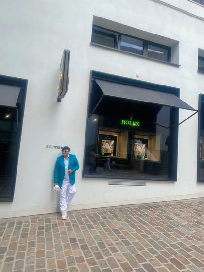 Posing outside the Rolex store in St. Moritz. This town is the epitome of luxury, which is reflected in its high-end boutiques and sophisticated style.