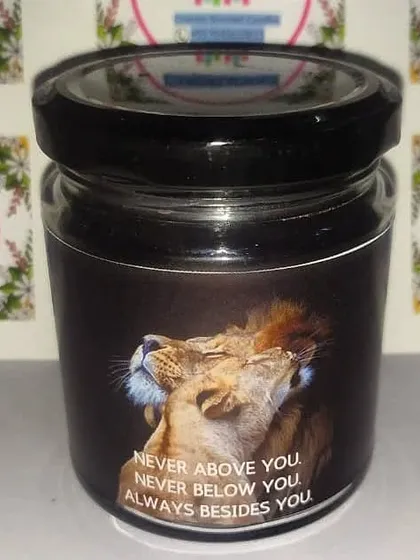 A perfect gift for your partner or a favorite couple. This scented jar candle features a powerful image and the quote "Never above you. Never below you. Always besides you."