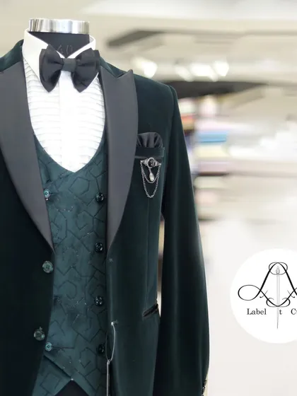 Each thread tells a tale of creativity. This green velvet tuxedo is a piece of wearable art, designed to turn your ideas into reality.