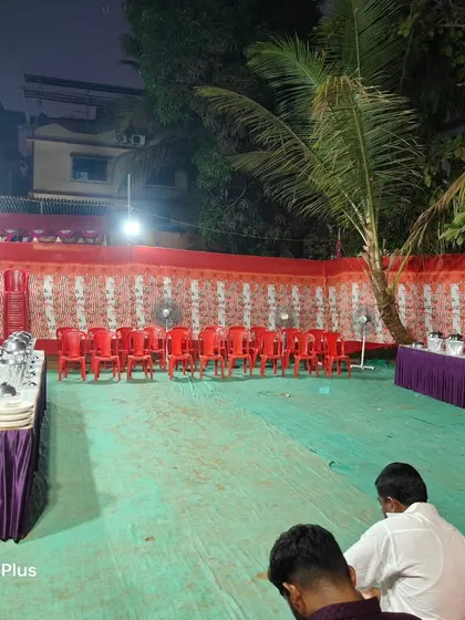A typical nighttime event setup on an open ground. We provide all the basics including tables for the buffet, seating arrangements with plastic chairs, and proper lighting so your function can run smoothly.