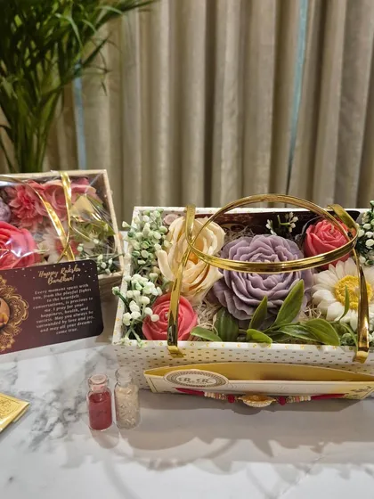 This Flower Bouquet Gift Hamper for Rakhi comes with a custom photo card, making it an incredibly personal gift. You can choose the fragrances and add your own message to create a cherished memory.