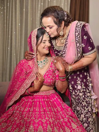 The final wedding day look for this bride, looking absolutely radiant in a bright pink lehenga.