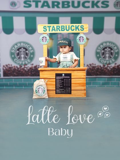 Latte love, baby! This little barista is ready to serve you a cup of cuteness from her very own Starbucks stand.