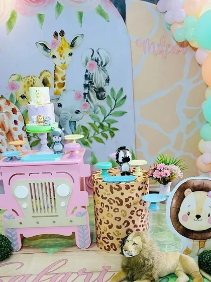 The complete pastel safari setup, showing how all the elements come together, from the printed floor and backdrop to the 3D props and balloon arch.