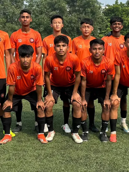 My U-17 team in their orange kit, ready for their league fixture.