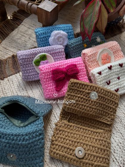 This image shows the functionality of our mini wallets, with one open to reveal the magnetic snap closure and another showing the zippered compartment. They are designed to be both cute and practical.