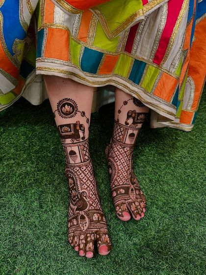 This storytelling mehndi extends to the feet, with each limb telling a part of the couple's journey. It's a unique way to have a fully personalized bridal design.
