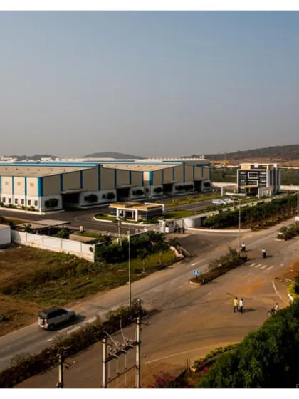 An expansive view of the Krishna Sai Granites campus, demonstrating our capability in industrial master planning. The layout strategically positions four main blocks, including three granite processing units and an admin building, for optimal operational efficiency across the 9.5-acre site.