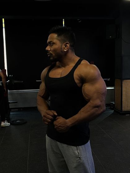 The pain means you're alive. A side pose in the shadows, reflecting on the journey.