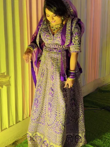 A unique purple and silver bridal lehenga. The rich color and heavy embroidery make it a standout choice for the modern bride looking for something different.