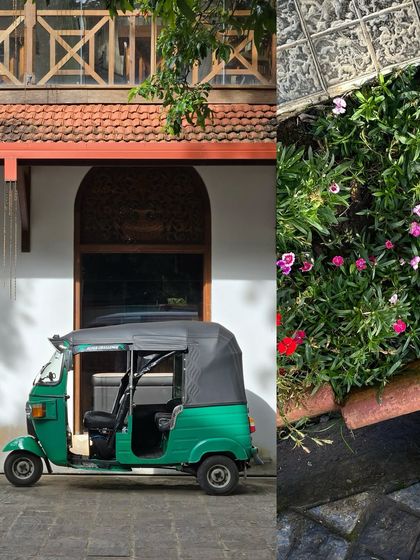 A parked green auto against a heritage-style building, a common yet picturesque sight in many of Mumbai's older neighborhoods.