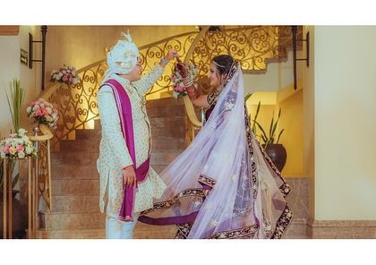 A playful, dynamic shot of the groom twirling his bride. Capturing movement like this adds a sense of fun and romance to the wedding album.