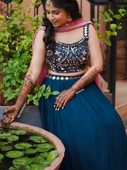 Another lovely shot of the client enjoying the moment, with her mehndi-adorned hands.