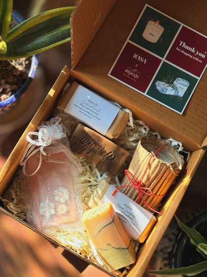 Another view of our Divinity Gift Box with Rasa Home. The combination of soothing scents from our soaps and their candles creates a complete relaxation experience.
