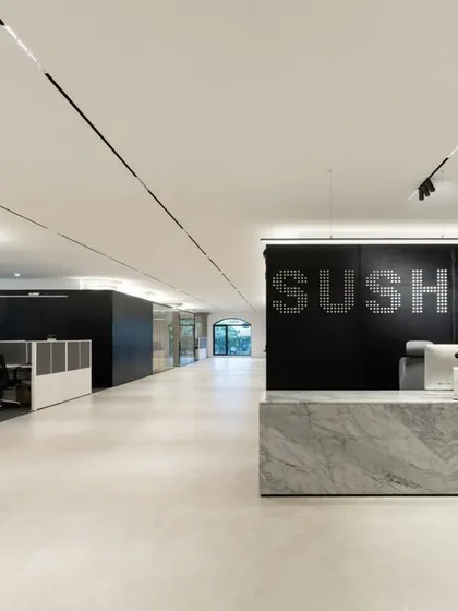 We believe workplaces must bring calm and order to our complex lives. For this high-intensity infrastructure company, we designed a reception area with a minimalist palette, featuring a monolithic marble desk and clean lines to create a serene, focused, and sophisticated environment.