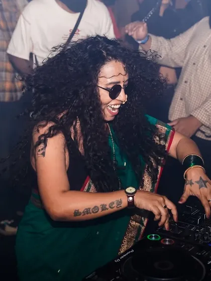 The pure joy of a live set. In this moment, surrounded by the crowd's energy at a packed Drum and Bass night, I feel completely alive. This is me in my element, mixing tracks in a saree and sharing my passion for bass music.