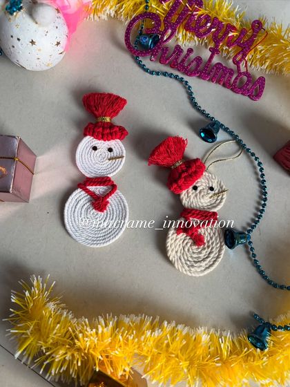 These little macrame snowmen are so adorable. They come with tiny hats and scarves and are perfect for adding a whimsical touch to your Christmas tree.
