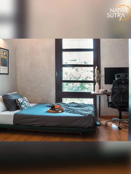 For this loft-style bedroom, we created a functional and stylish space perfect for a young professional. The design combines industrial-inspired concrete texture walls with warm wooden flooring and includes a dedicated workspace, demonstrating how we tailor designs to modern lifestyles.