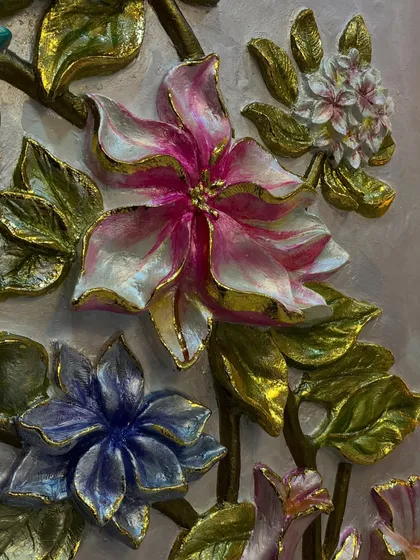 The delicate pink and white flower with gold-tipped leaves is one of my favorite parts of this composition.