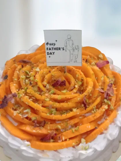 Celebrate Dad with this beautiful fresh mango cake. I arrange slices of sweet, seasonal mango into an intricate rose design over a light, airy sponge, making it a refreshing and heartfelt treat for Father's Day or any family milestone.