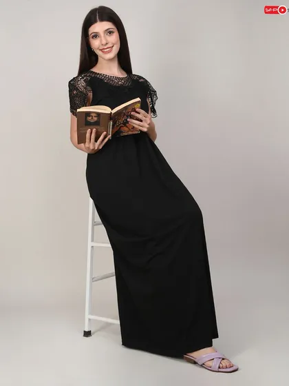 A lifestyle shot for the same nightgown, using a prop book to create a relaxed, comfortable mood. This helps customers connect emotionally with the product.
