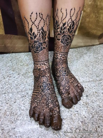 This angle highlights the intricate floral bands that wrap around the ankles and feet.