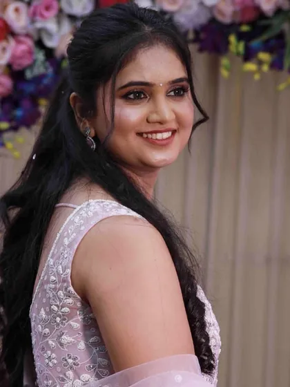A beautiful look for a Ring Ceremony. The makeup is fresh and radiant, with soft waves in her hair to create an effortlessly elegant style.
