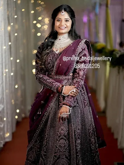 For a modern reception look, this bride is wearing a stunning diamond-look choker set with a matching maang tikka. It pairs beautifully with her elegant purple lehenga, showing how versatile my collection is for all your wedding events.