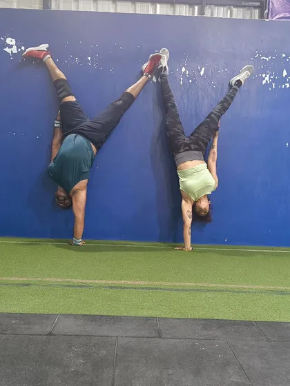 We are always pushing each other to get the best out of every workout. A little partner handstand fun to build shoulder stability and trust.