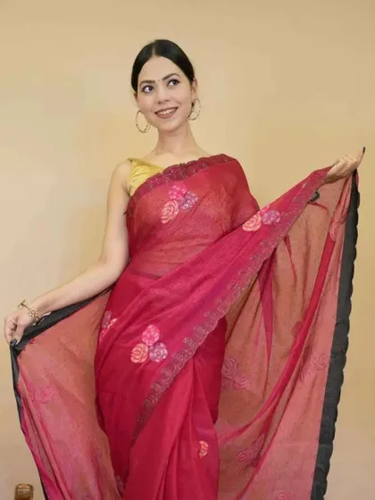 A simple yet beautiful red 1-minute saree with embroidered floral motifs. This piece is lightweight and perfect for casual gatherings where you want to look elegant without the effort.