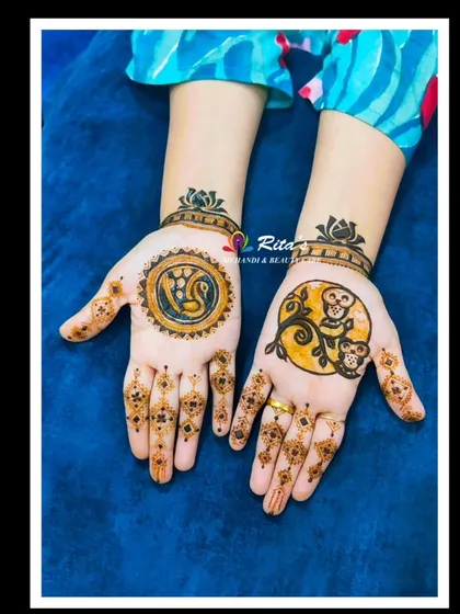 This client wanted to combine her love for owls and peacocks. I created these unique circular designs on her palms, one for each of her favorite birds.