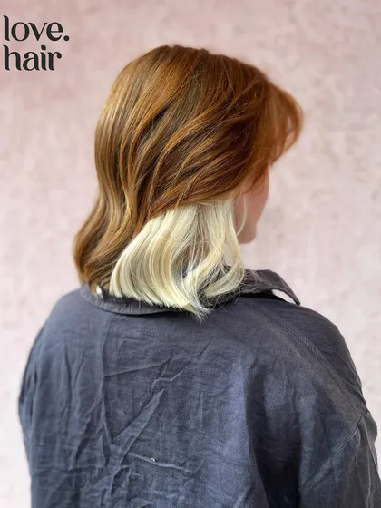The back view showing the surprise of the white-blonde peekaboo color.
