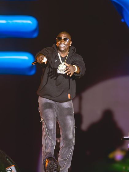 A close-up shot of Akon engaging with the crowd during his high-energy set.