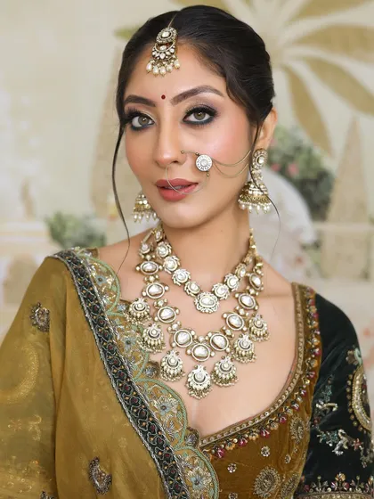 A close-up of a radiant and elegant bridal look, perfect for the big day. The makeup features a smokey eye and a flawless base.