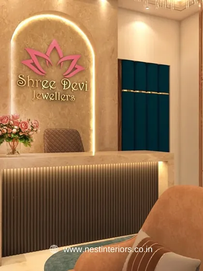 The reception desk is the first point of contact for your customers. For this jewelry store, I designed a reception area with a backlit brand logo, textured wall panels, and elegant lighting to make a strong first impression.
