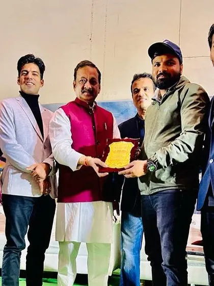 Receiving an award alongside other officials at the 2nd Indian Open MMA Championship.