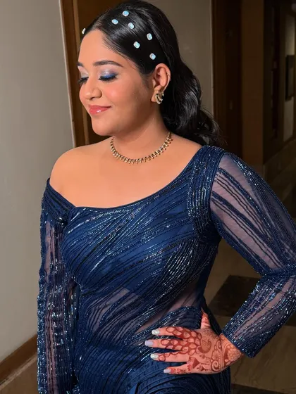 A close-up showing the detail of the blue eyeshadow. The shimmer adds a touch of glamour, while the clean base and soft lip keep the look sophisticated and not overdone.