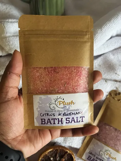 A hand-held shot of the Citrus & Rosemary bath salt. The vibrant color comes from natural ingredients, and the scent is incredibly invigorating.