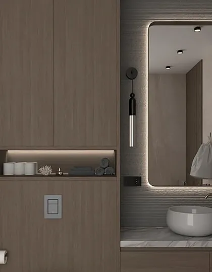 This bathroom design shows how I use vertical space and smart lighting to make even small bathrooms feel luxurious. The floor-to-ceiling wood-finish cabinet provides extensive storage, while the backlit mirror adds a touch of modern elegance.