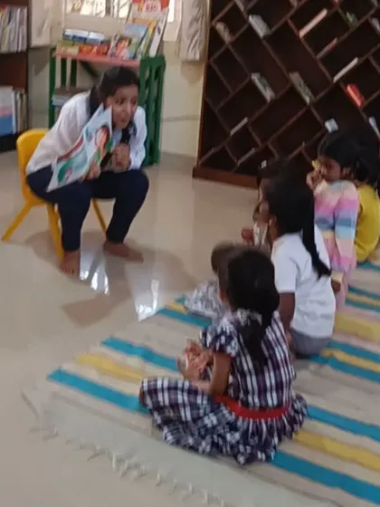 A small group of girls listens intently to a story. We offer sessions for different age groups to ensure the content is always appropriate and engaging.