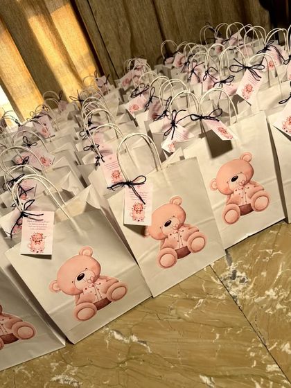A full display of our teddy bear-themed return gift bags, all lined up and ready to be delivered. We ensure every bag is perfectly assembled and looks just right.