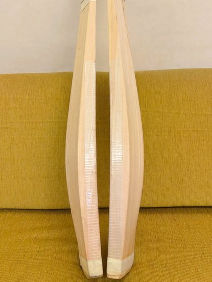 The side profile of the bats, showing the thickness of the edges and the shape of the spine. This profile is crucial for a bat's balance and power.