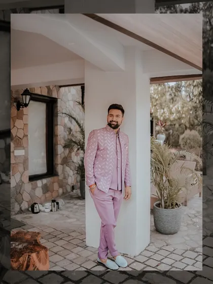 The groom deserves his own stylish portraits too. Here's Rajat looking dapper in his lavender outfit, captured in a quiet moment before the Mehendi festivities began.