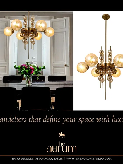A beautiful example of a transitional chandelier, blending classic globe shapes with a modern structure. It’s versatile enough to complement both a formal dining room and a more relaxed living space.