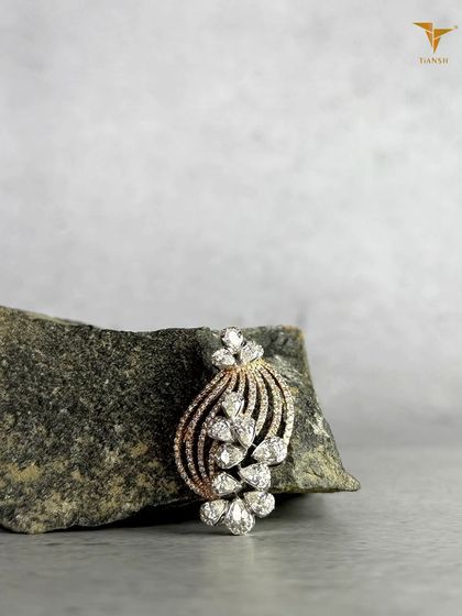 Diamonds shaped like petals, curves shaped with intention. This elegant diamond pendant is crafted to sit beautifully, wherever you wear it.